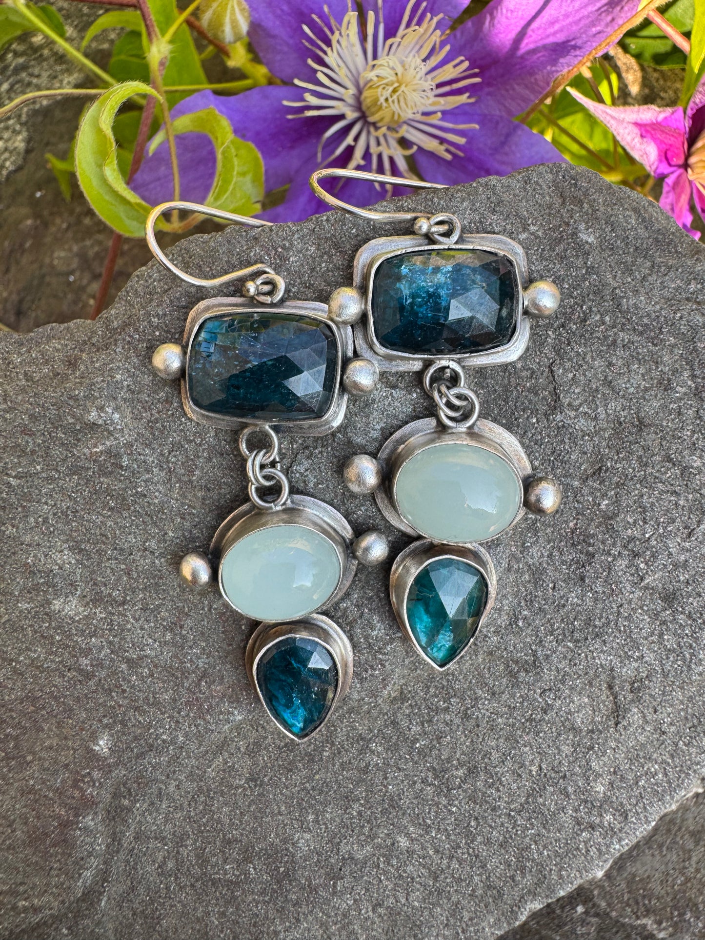 Silver earrings pairing blue kyanite cabochons with soft aquamarine stones