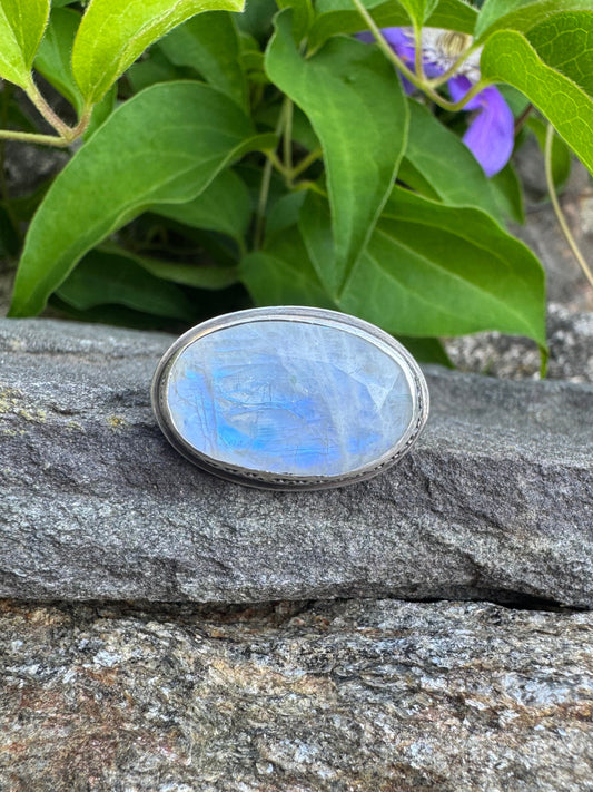 Handmade sterling silver wide moonstone oval ring in sterling silver with textured band, front view