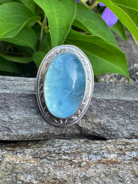 Handmade sterling silver large aquamarine oval ring in sterling silver with carved bezel, front view