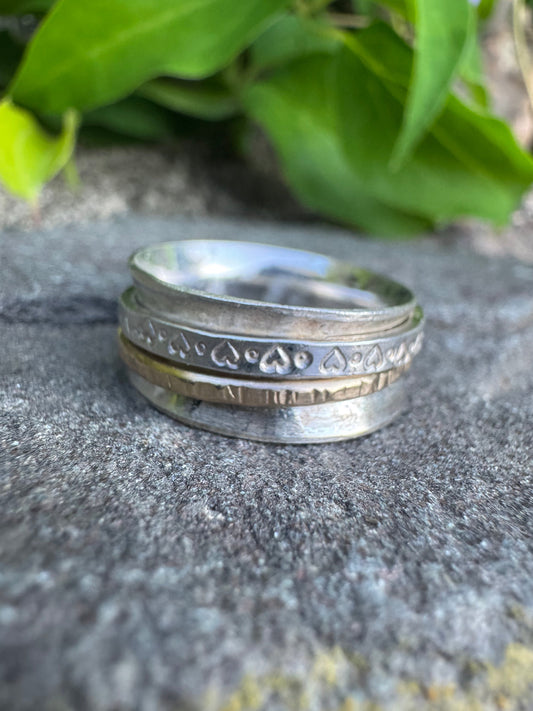 Handmade sterling silver textured wide spinner band, front view