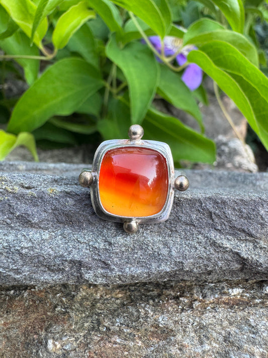Handmade sterling silver carnelian ring with bronze detailing, front view