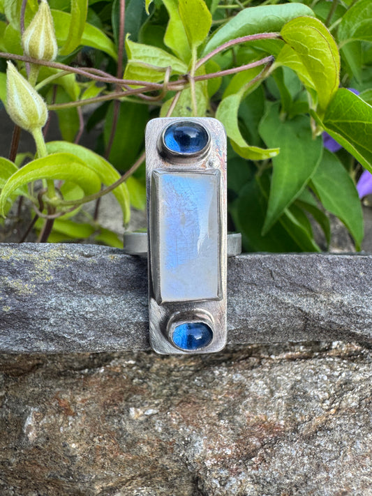 Handmade sterling silver elongated moonstone and sapphire ring, front view