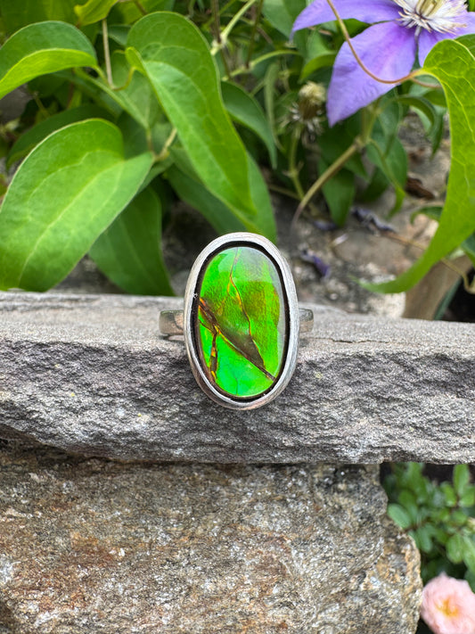 Handmade sterling silver ammolite oval ring with green tourmaline, front view