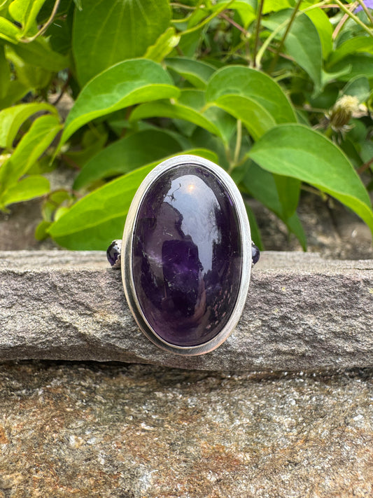 Handmade sterling silver frosted and polished amethyst three-stone ring, front view