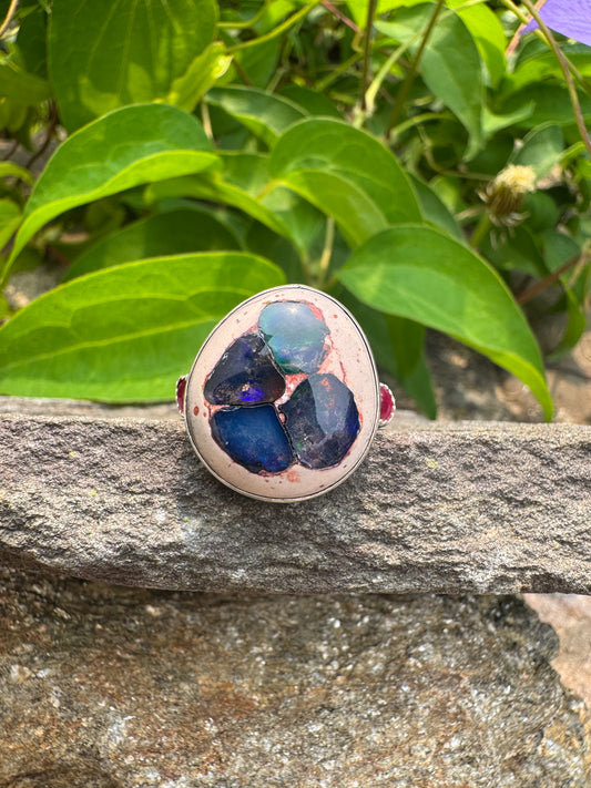 Handmade sterling silver fire opal, pink sapphire and blue sapphire ring, front view
