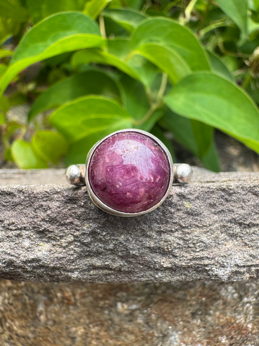 Handmade sterling silver faceted ruby round ring, front view