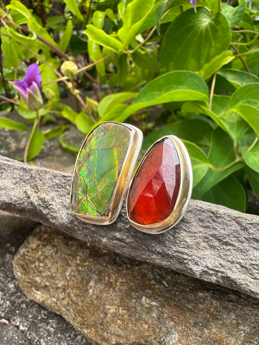 Handmade sterling silver garnet and ammolite ring, set in 14k gold, front view