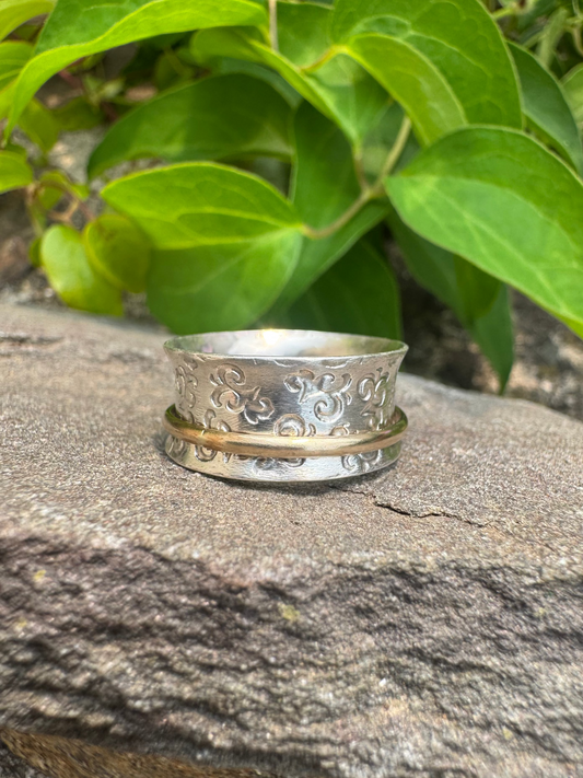 Handmade sterling silver hand-engraved wide spinner band, front view