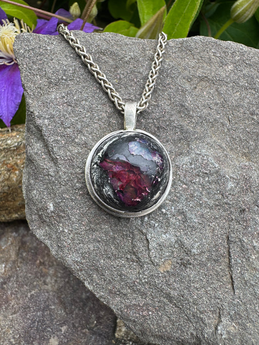 Handmade sterling silver fire opal pendant in sterling silver with rolled border, front view