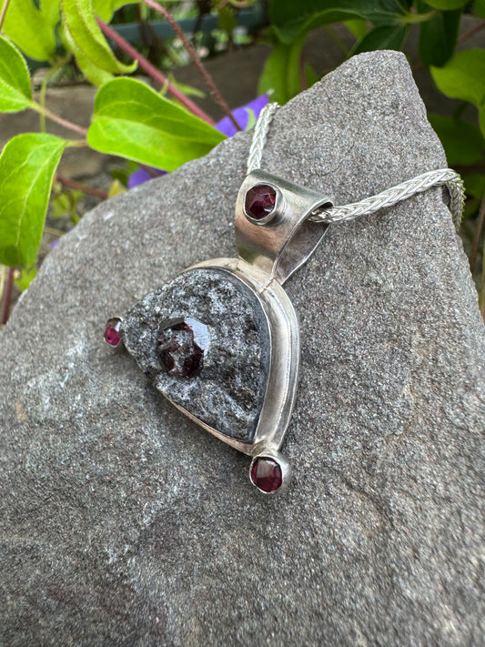Handmade sterling silver rough garnet shield pendant, front view