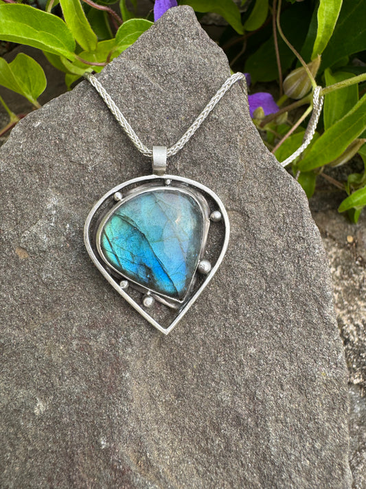 Handmade sterling silver triangular labradorite pendant in sterling silver with open frame, front view