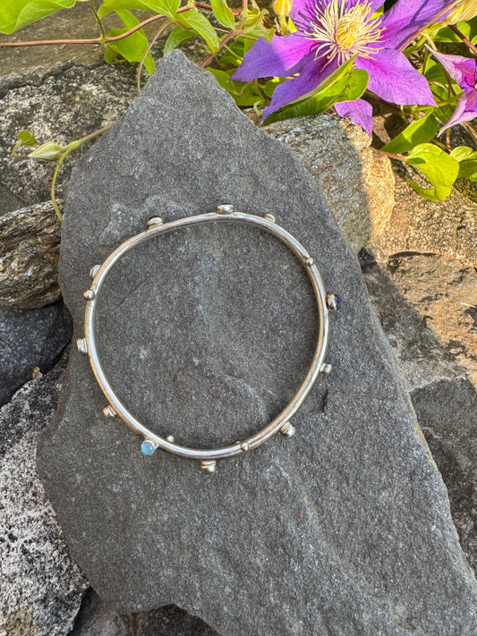 Handmade sterling silver amethyst and aquamarine bangle bracelet, front view