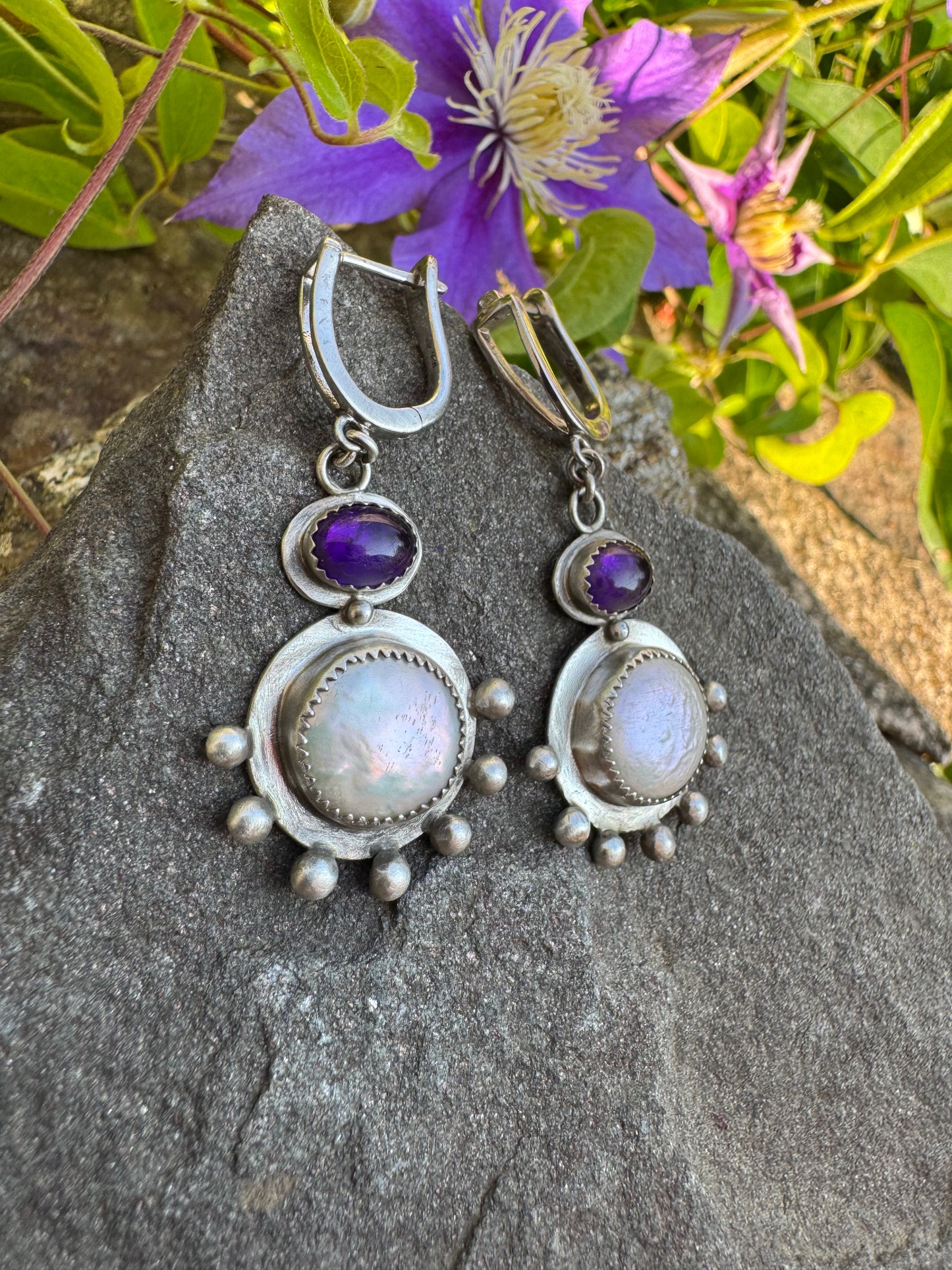 Silver lever-back earrings with deep purple amethyst cabochons and coin pearl accents