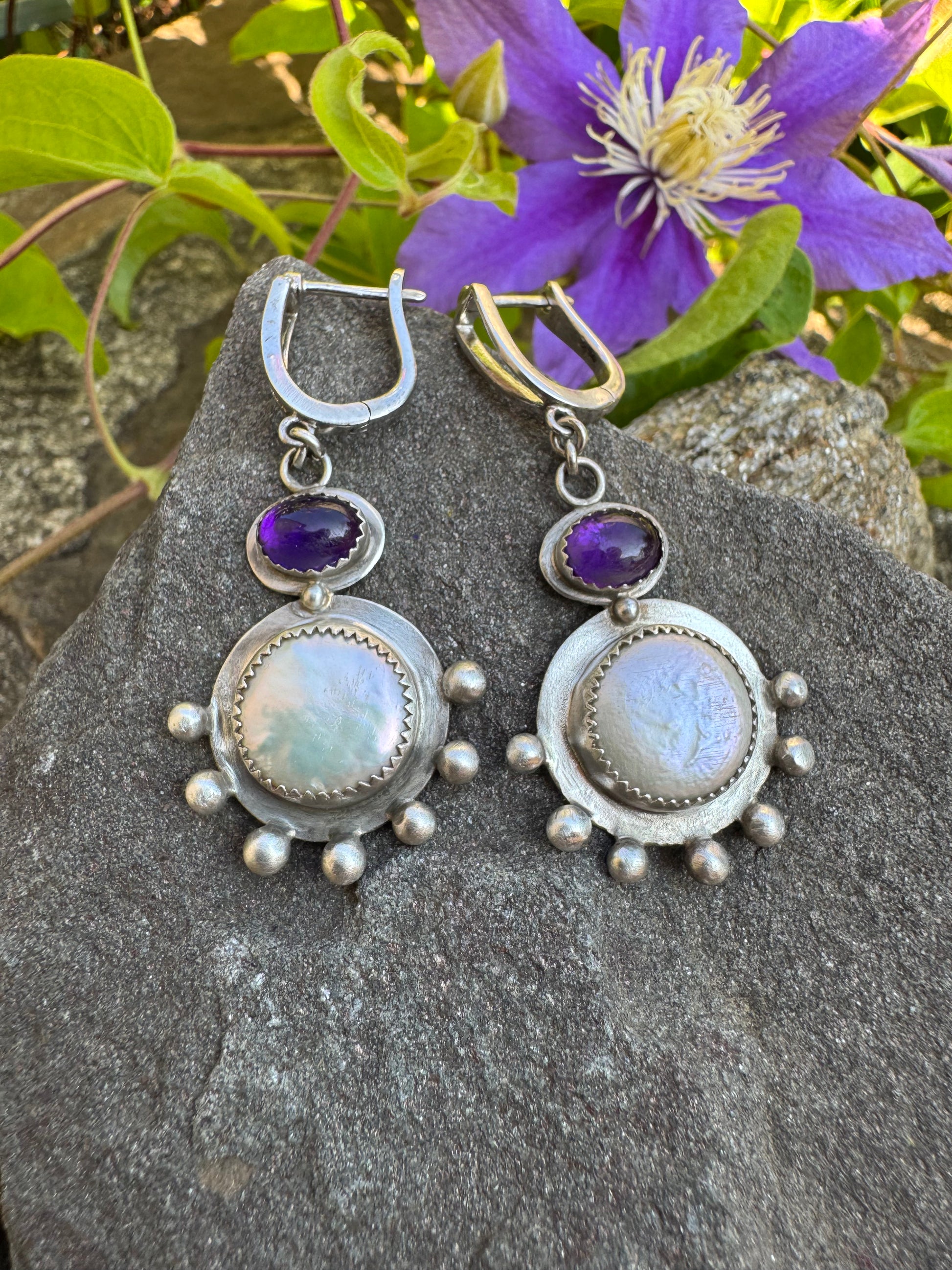 Silver lever-back earrings with deep purple amethyst cabochons and coin pearl accents