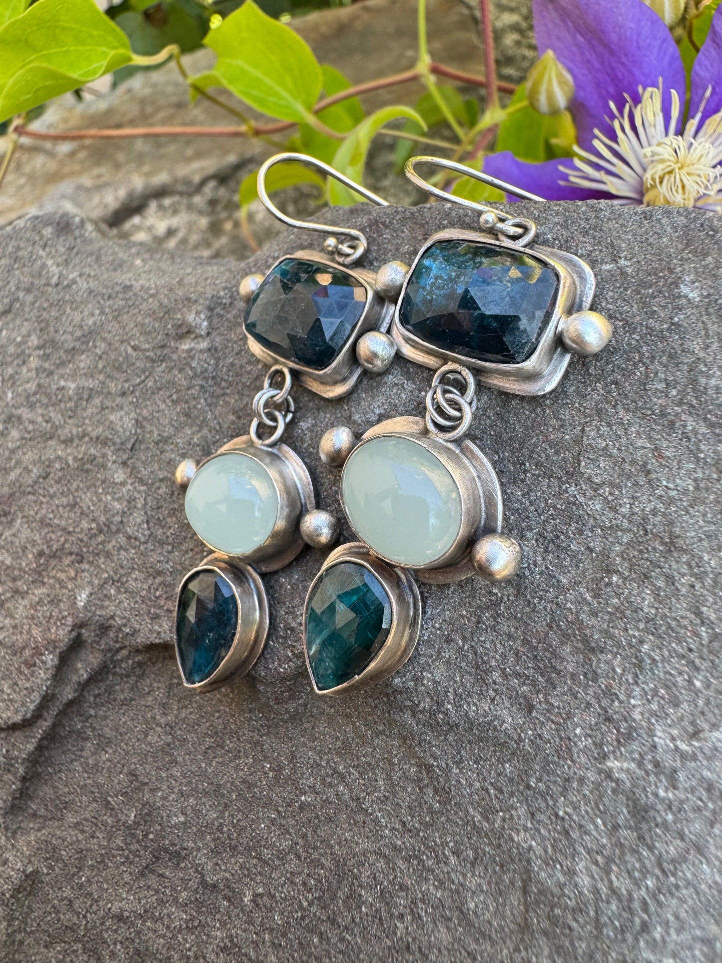 Silver earrings pairing blue kyanite cabochons with soft aquamarine stones