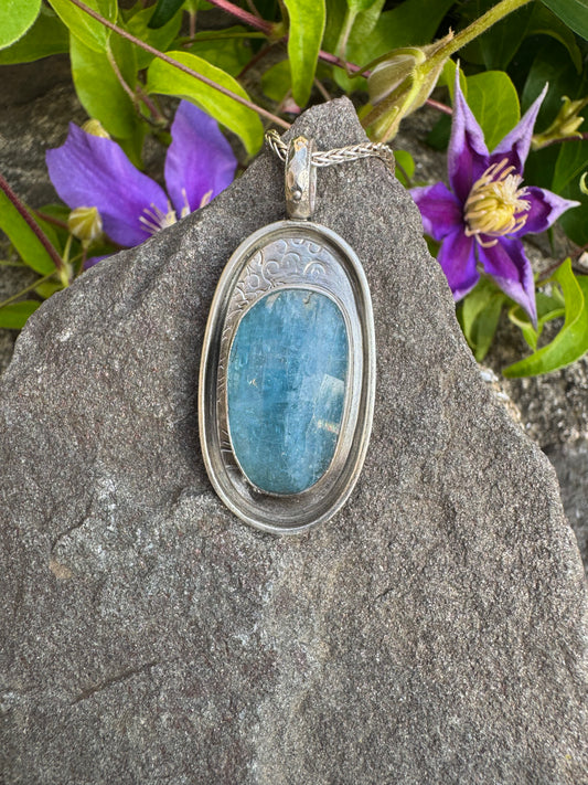 Handmade sterling silver aquamarine oval pendant in hand-engraved sterling silver, front view