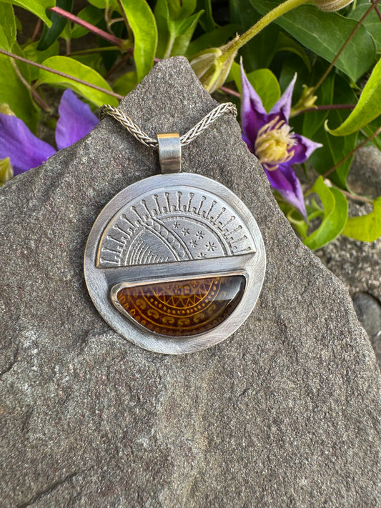 Handmade sterling silver carved amber pendant, front view