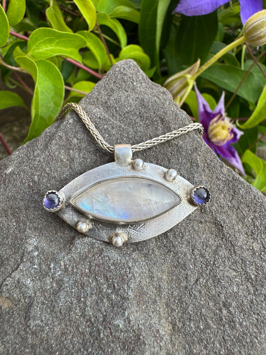 Handmade sterling silver moonstone marquise pendant with iolite, front view