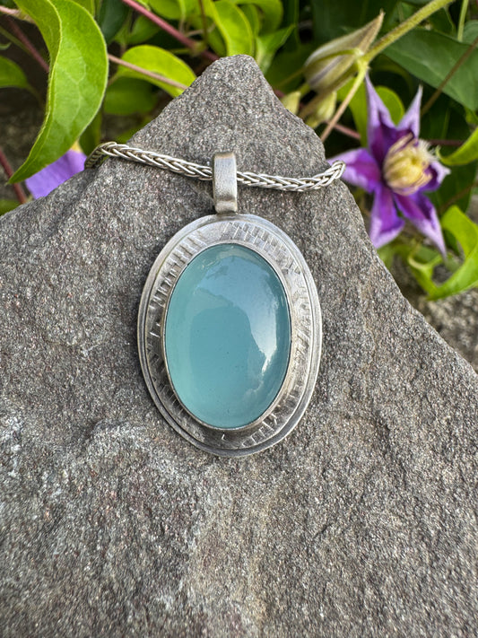 Handmade sterling silver aquamarine oval pendant in textured sterling silver, front view