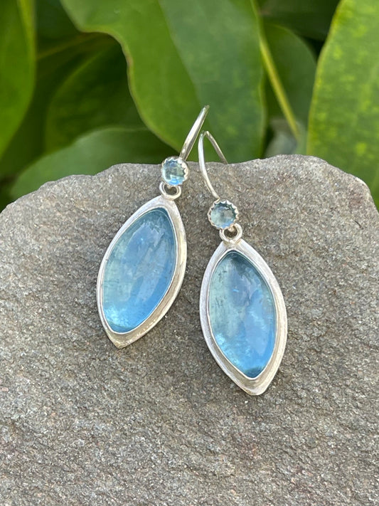 Handmade sterling silver aquamarine teardrop earrings in polished sterling silver, front view