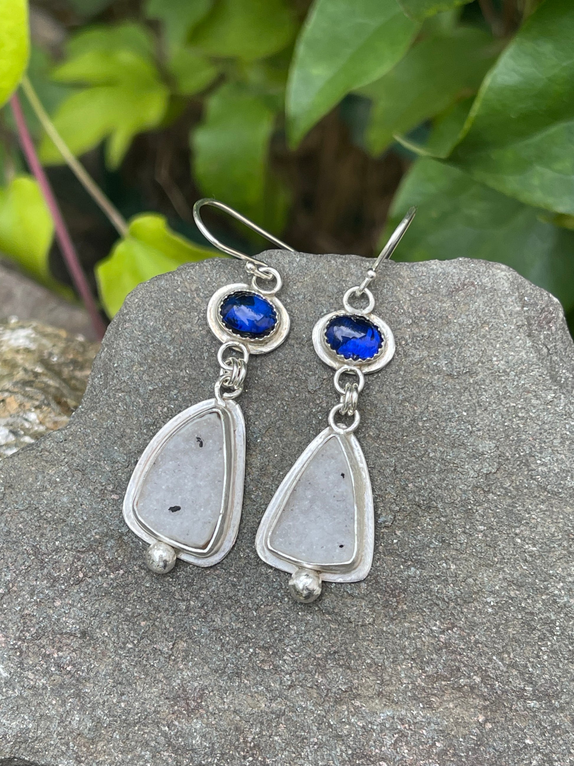 Silver earrings with royal blue oval sapphires above soft white druzy drops